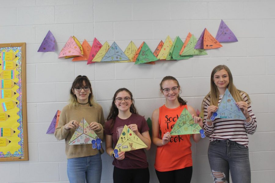 The winners from the second competition pose with their health triangles.